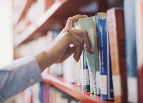 Choosing book from shelf