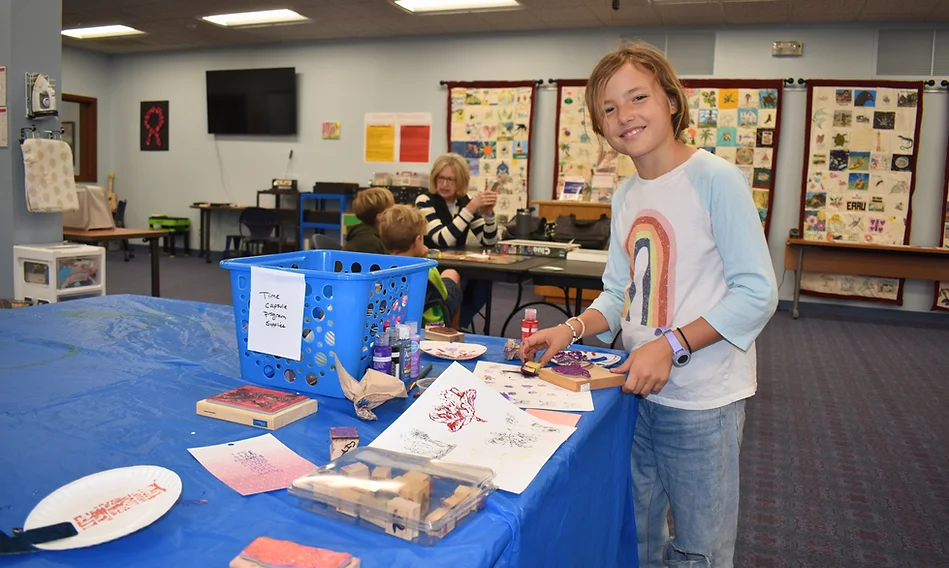 Girl showing her crafts
