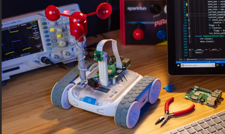 Robot next to a computer