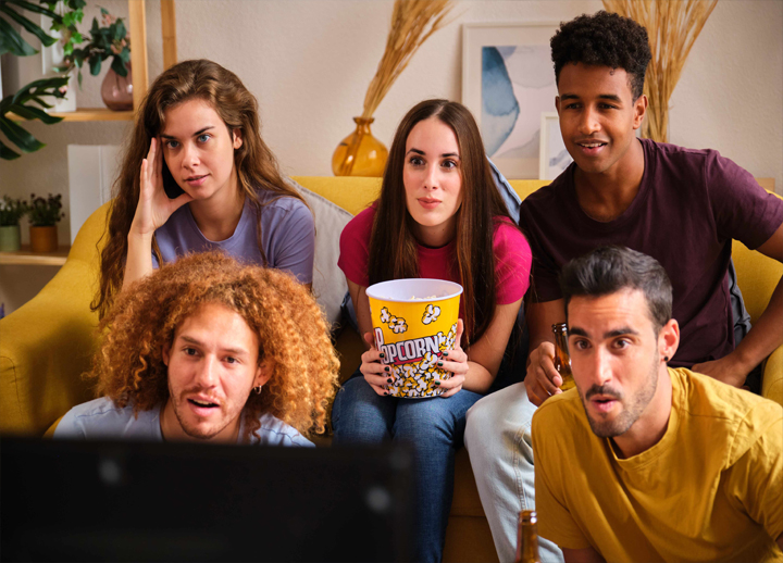 Man and daughter watching show or movie on a tablet